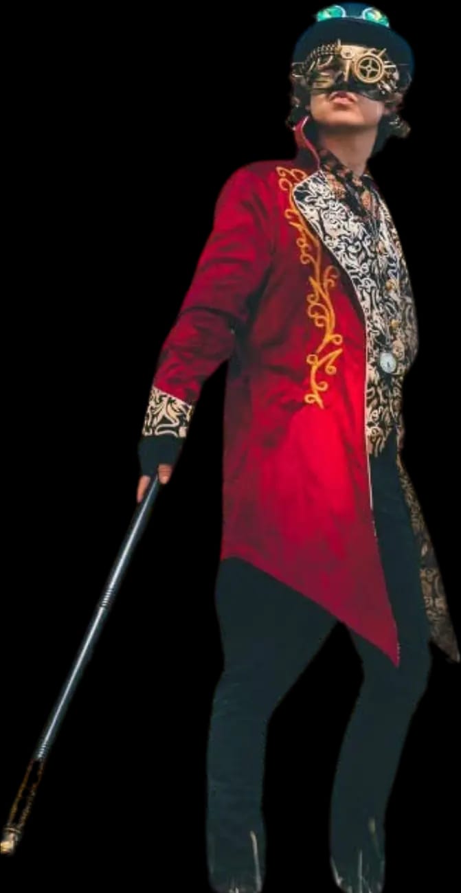 The Machinist cut out of his photograph: full length in a red tailcoat and brass-goggled top hat, cane in hand.